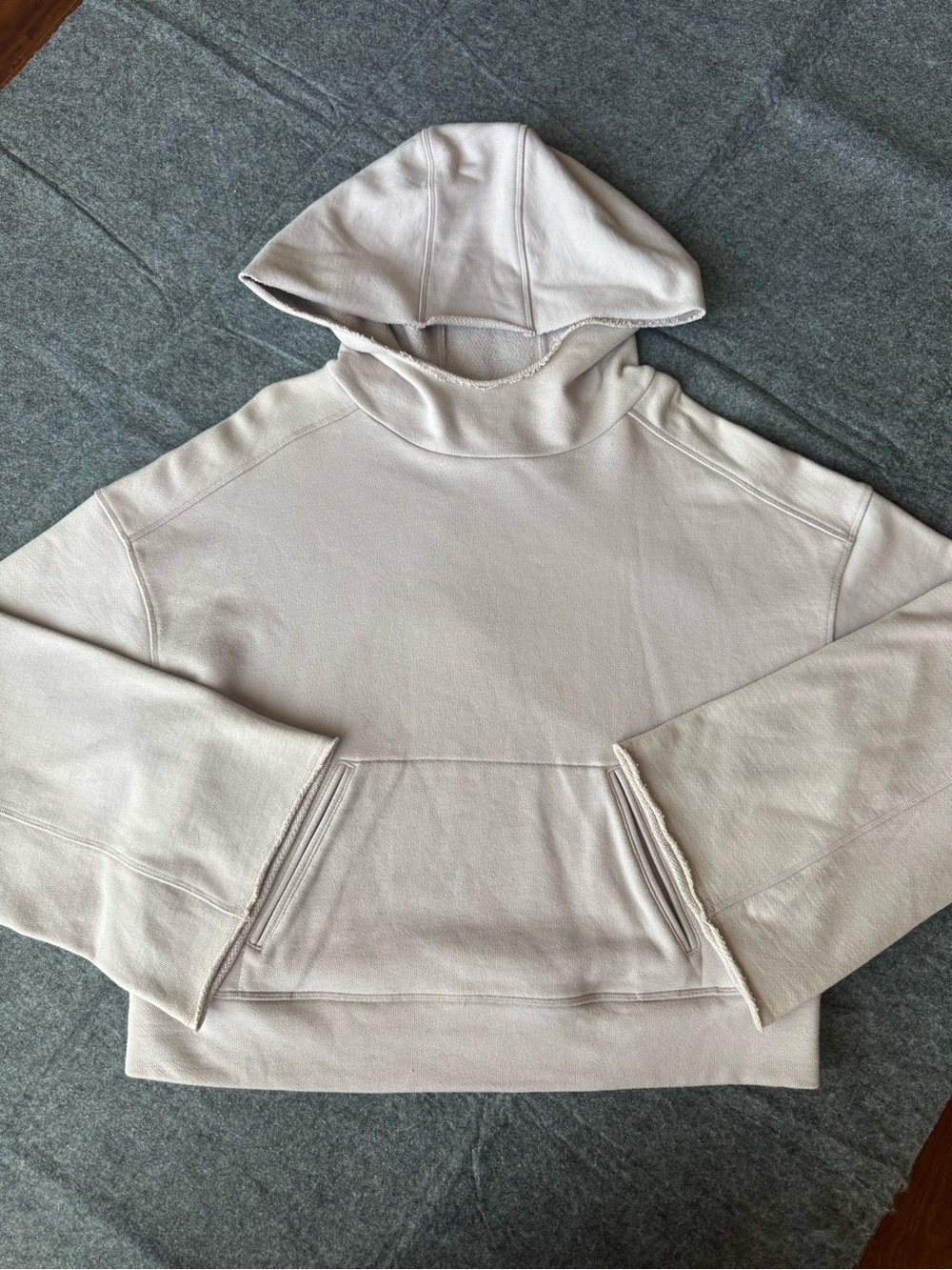 Alo Yoga Baby Pink Low Key Crop Hoodie with Raw Hem Bell Sleeves